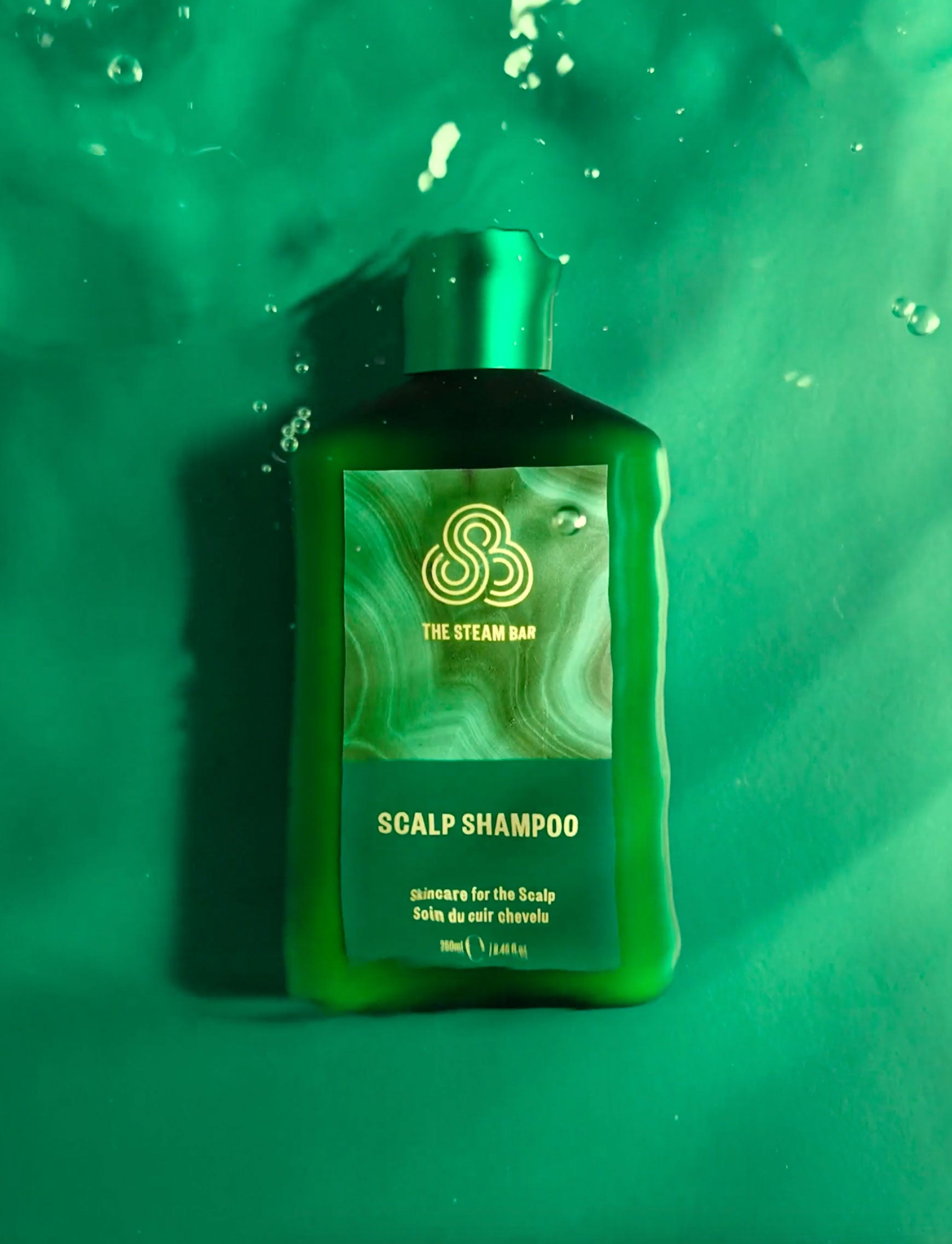 The Steam Bar's The Scalp Shampoo product submerged in water